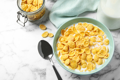 Photo of Flat lay composition with tasty corn flakes on marble table