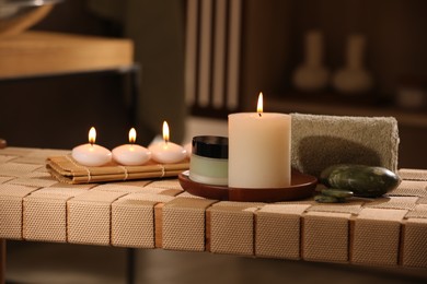 Photo of Beautiful composition with different spa products on wicker bench indoors