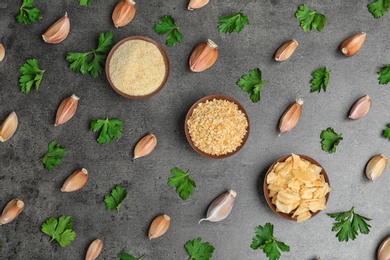 Photo of Flat lay composition with garlic products on grey background