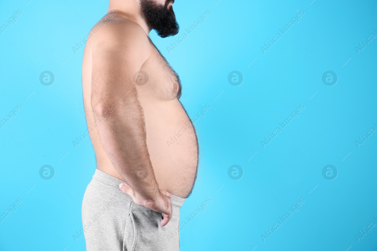 Photo of Fat man on color background, space for text. Weight loss
