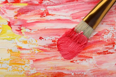 Painting with colorful oil paints on white canvas, closeup view