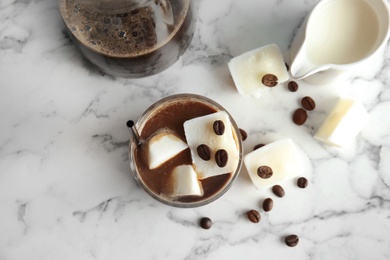 Photo of Composition with coffee drink and milk ice cubes on marble background, top view