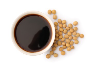 Photo of Bowl of soy sauce and soybeans isolated on white, top view