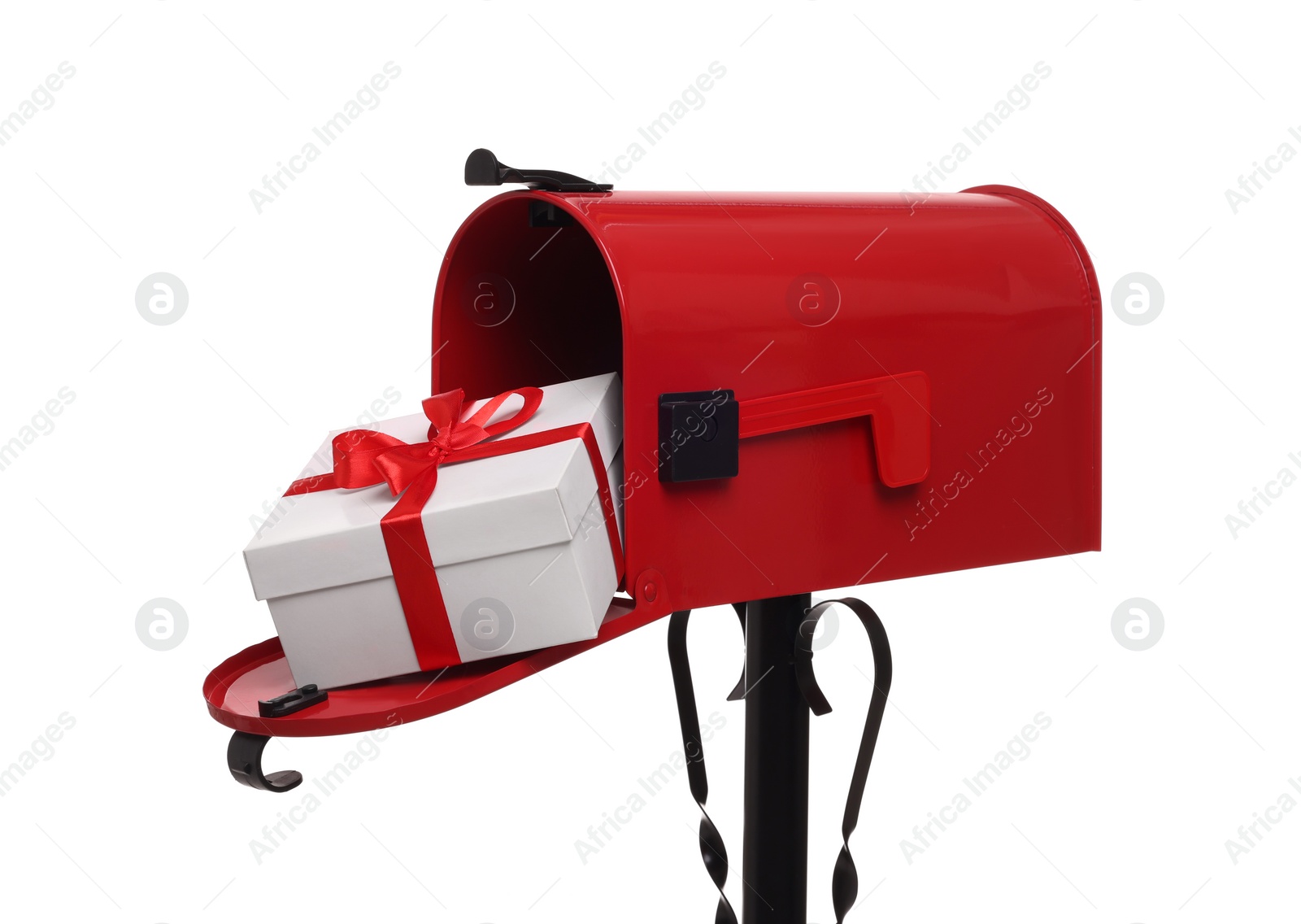 Photo of Red mailbox with Christmas gift isolated on white. Sending present by mail