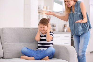 Mother arguing with son at home