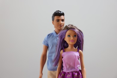 Leiden, Netherlands - September 20, 2023: Stylish Barbie and Ken dolls on light gray background, selective focus