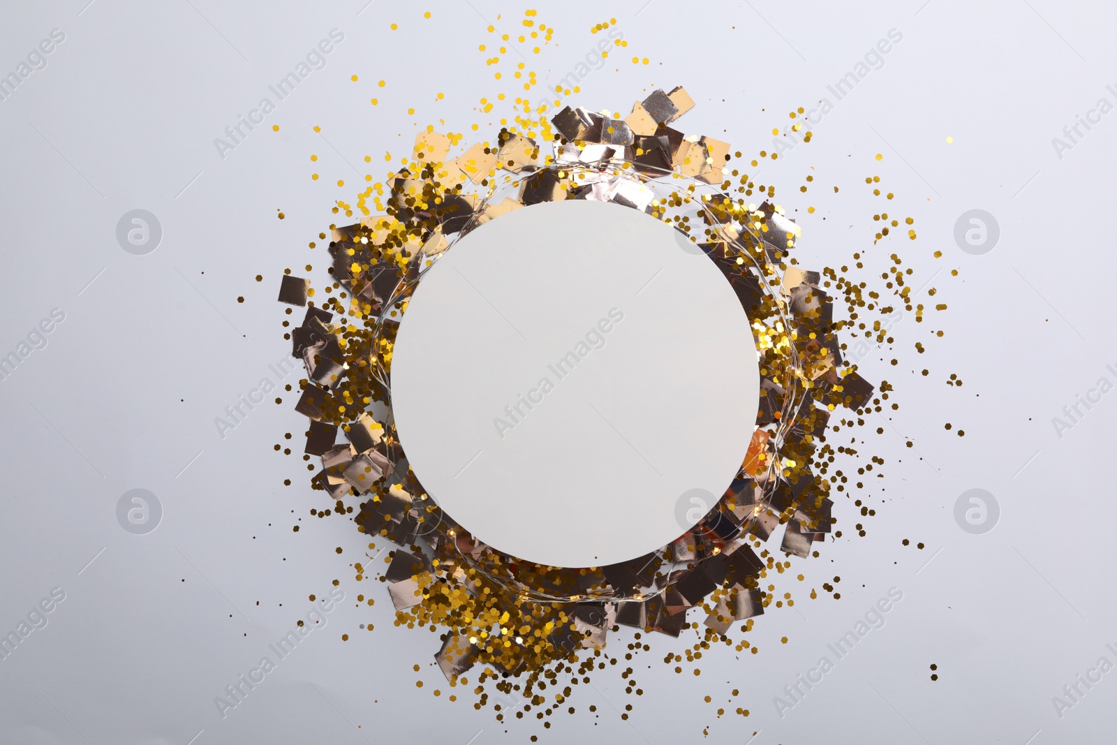 Photo of Flat lay composition with confetti on white background. Space for text