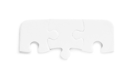 Photo of Blank puzzle pieces isolated on white, top view