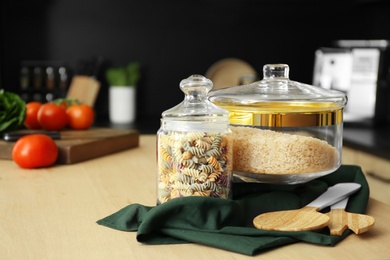 Photo of Products on wooden table in modern kitchen