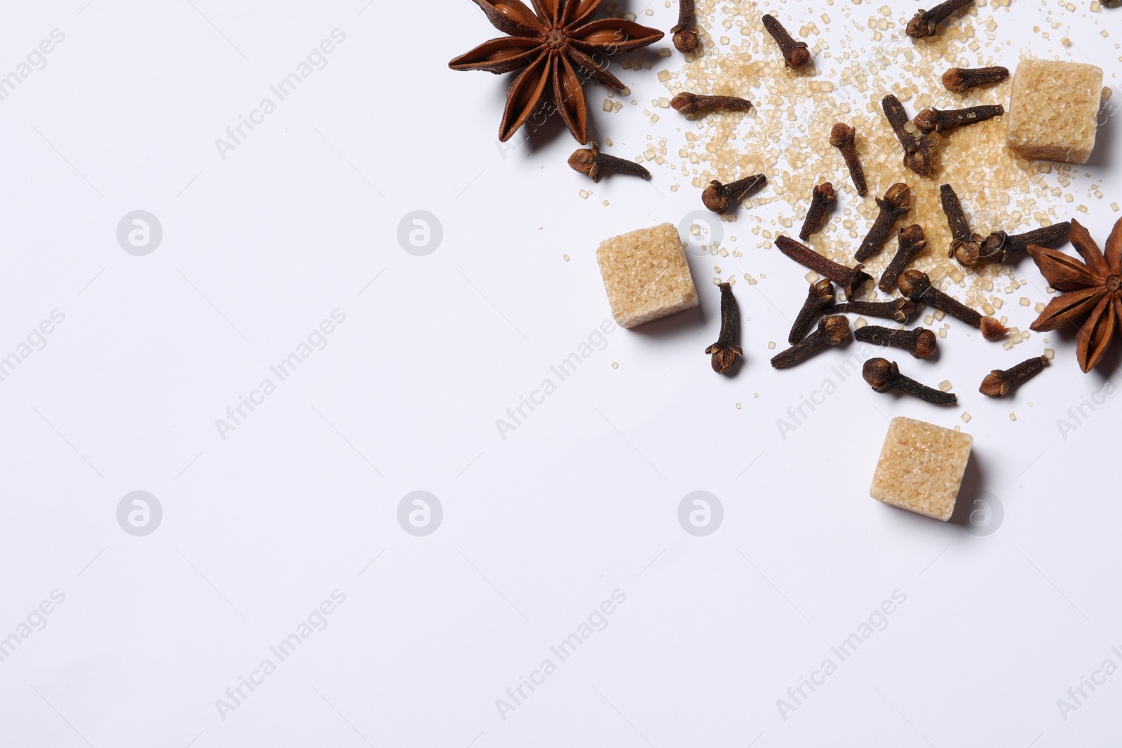 Photo of Different spices on white table, flat lay. Space for text