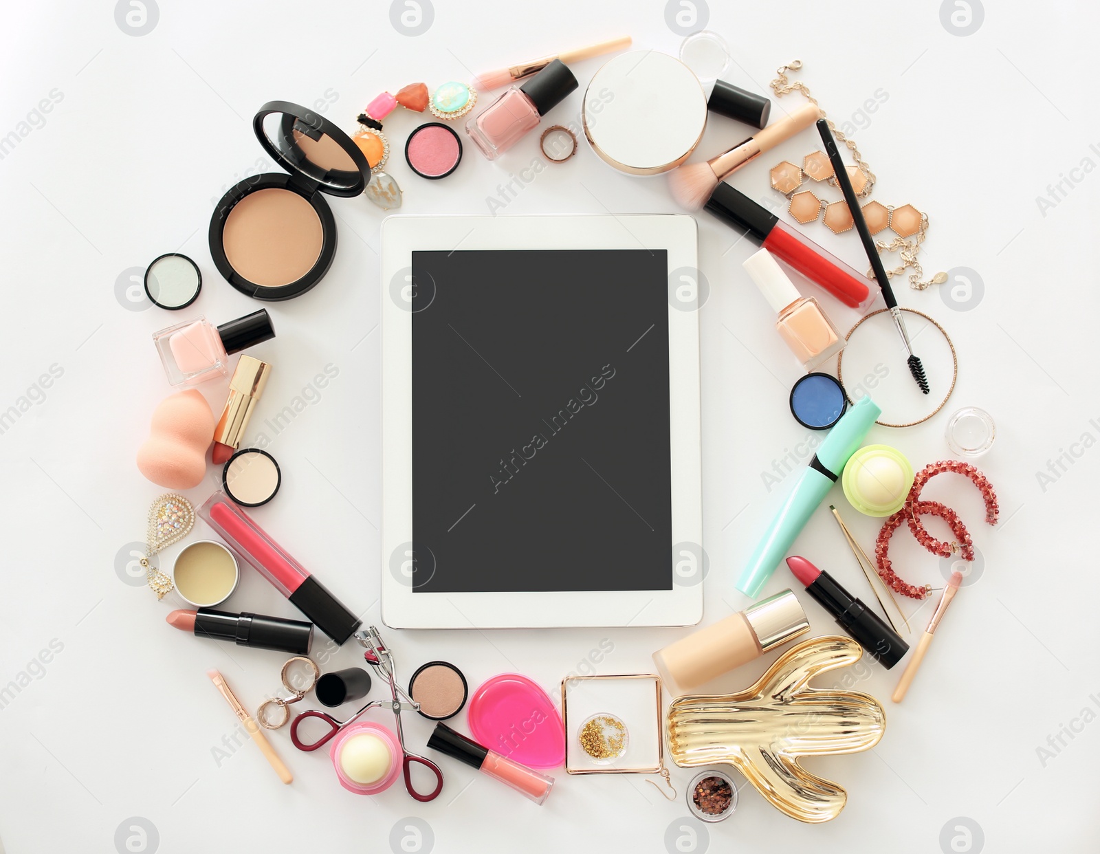 Photo of Flat lay composition with makeup products for woman and tablet on light background