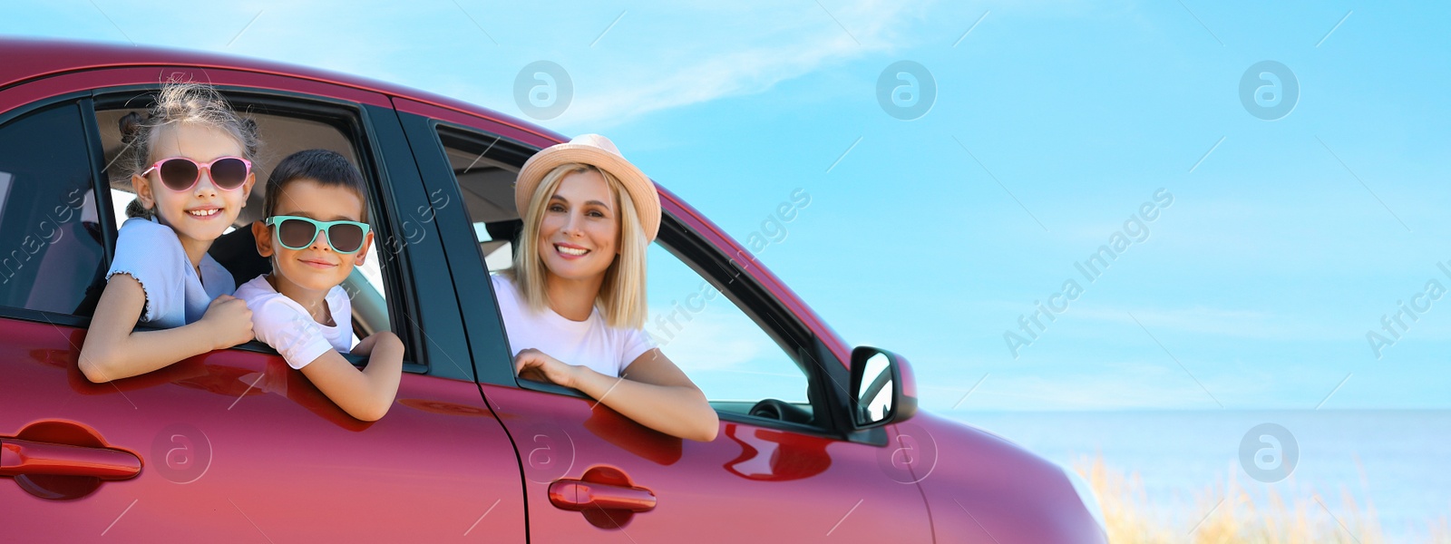 Image of Happy family in car at beach on sunny day. Banner design