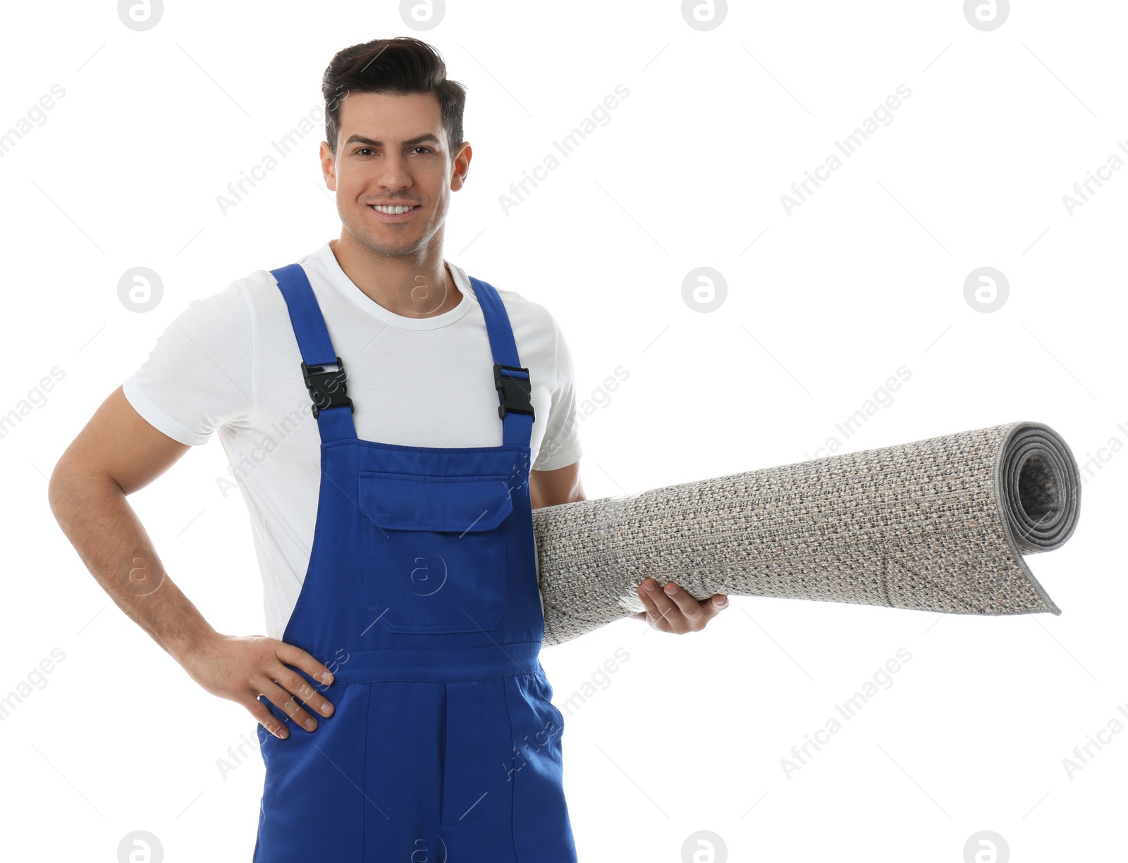 Photo of Male worker with rolled carpet on white background