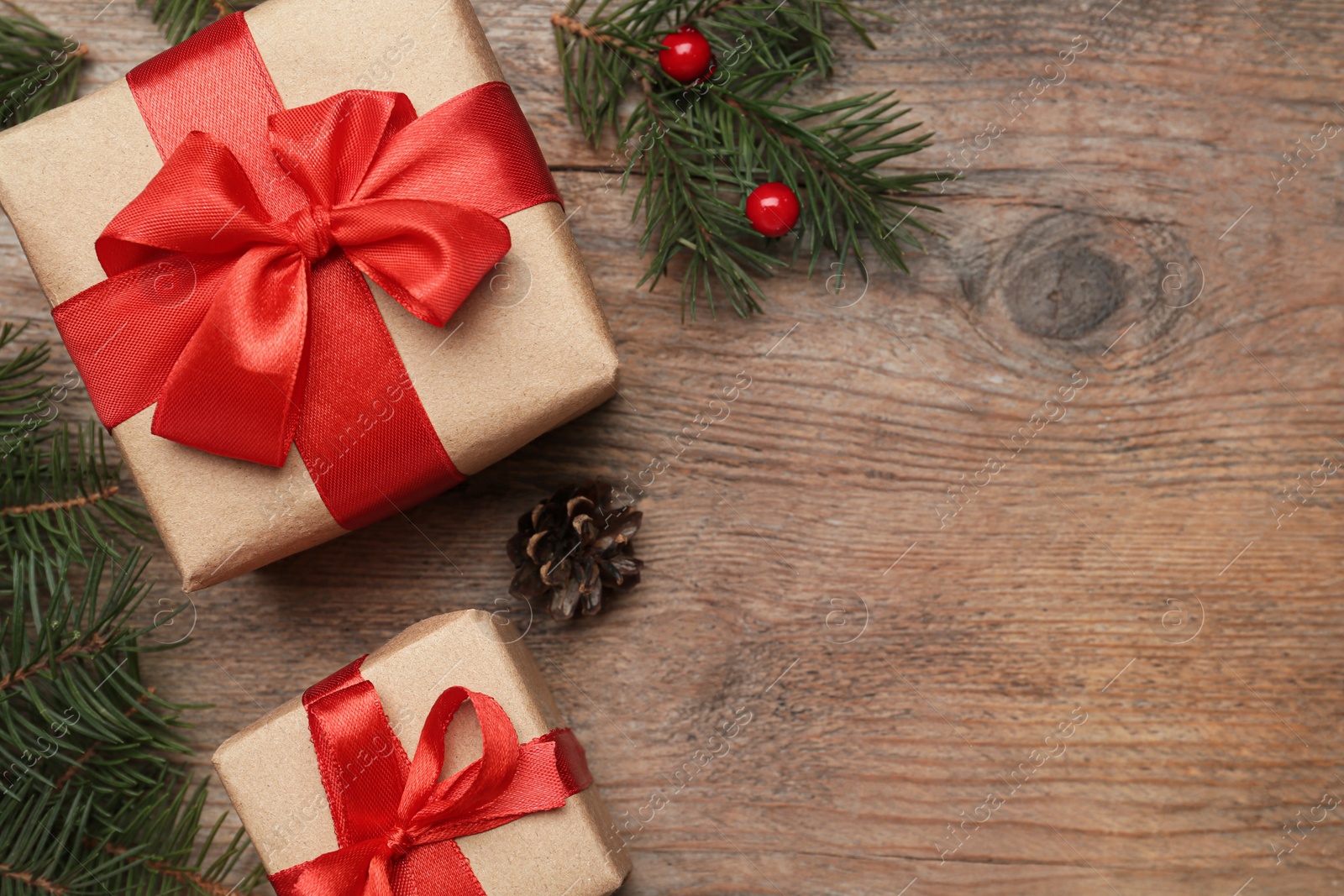 Photo of Flat lay composition with Christmas gifts on wooden table, space for text. Boxing day