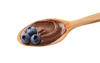 Photo of Wooden spoon with delicious chocolate paste and blueberries isolated on white