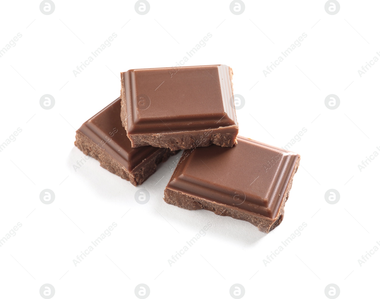 Photo of Pieces of tasty milk chocolate on white background