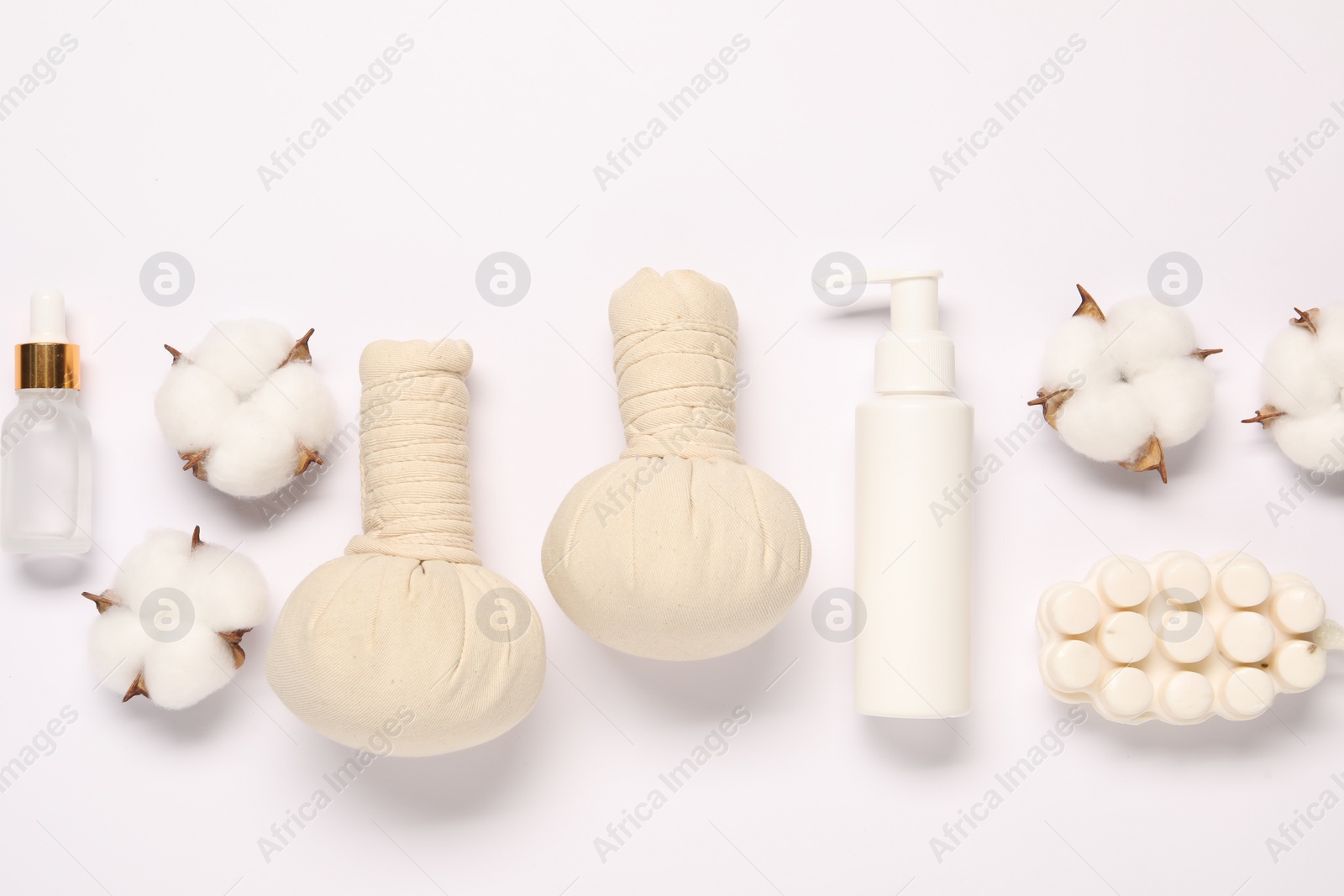 Photo of Bath accessories. Different personal care products and cotton flowers on white background, flat lay