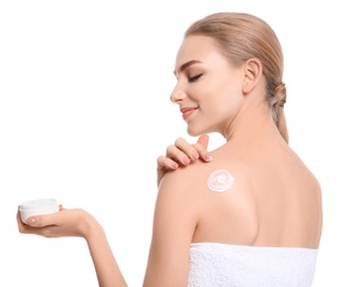 Young woman with jar of body cream on white background