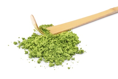 Powdered matcha tea and bamboo chashaku on white background