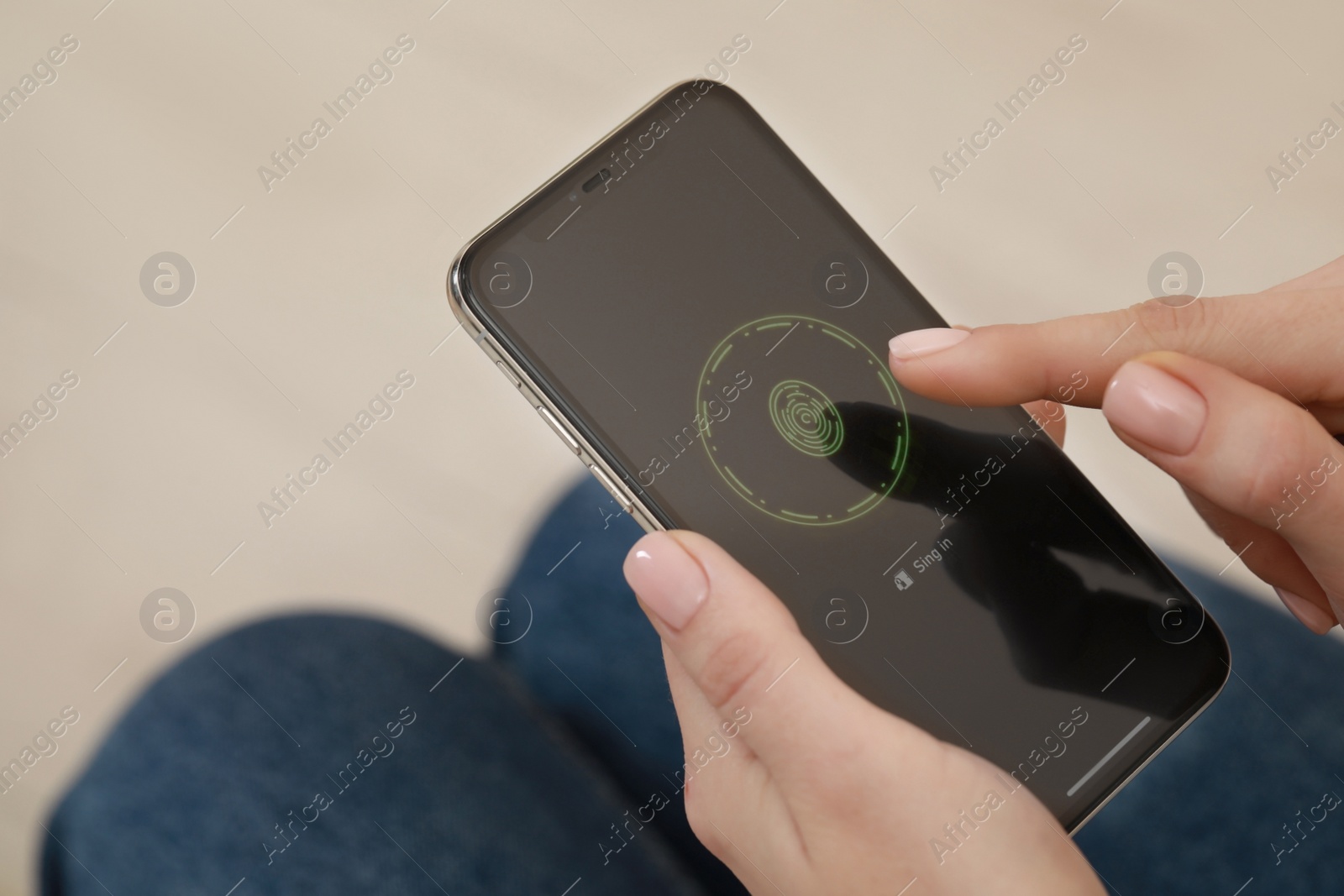 Photo of Woman unlocking smartphone with fingerprint scanner indoors, closeup. Space for text