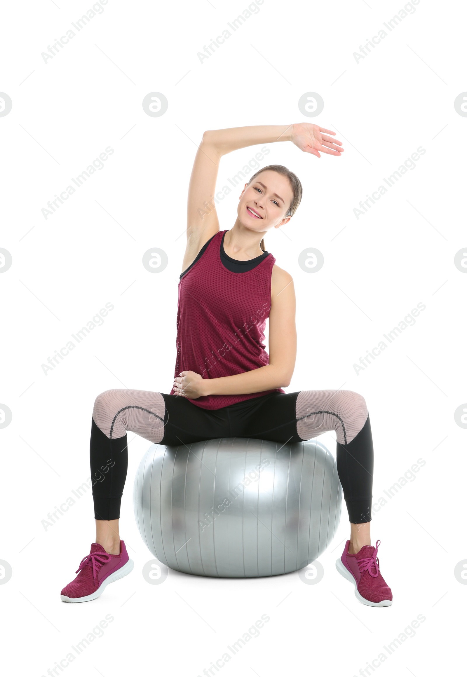 Photo of Young woman doing sports exercises isolated on white. Home fitness