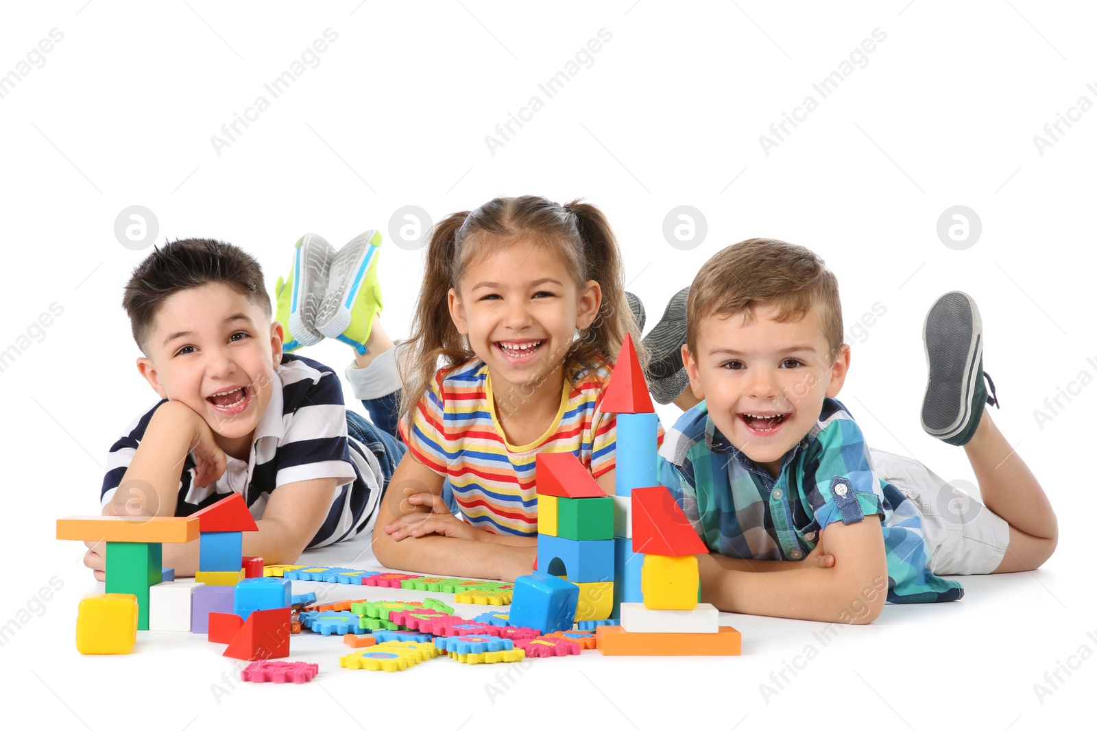 Photo of Little children playing together on white background. Indoor entertainment