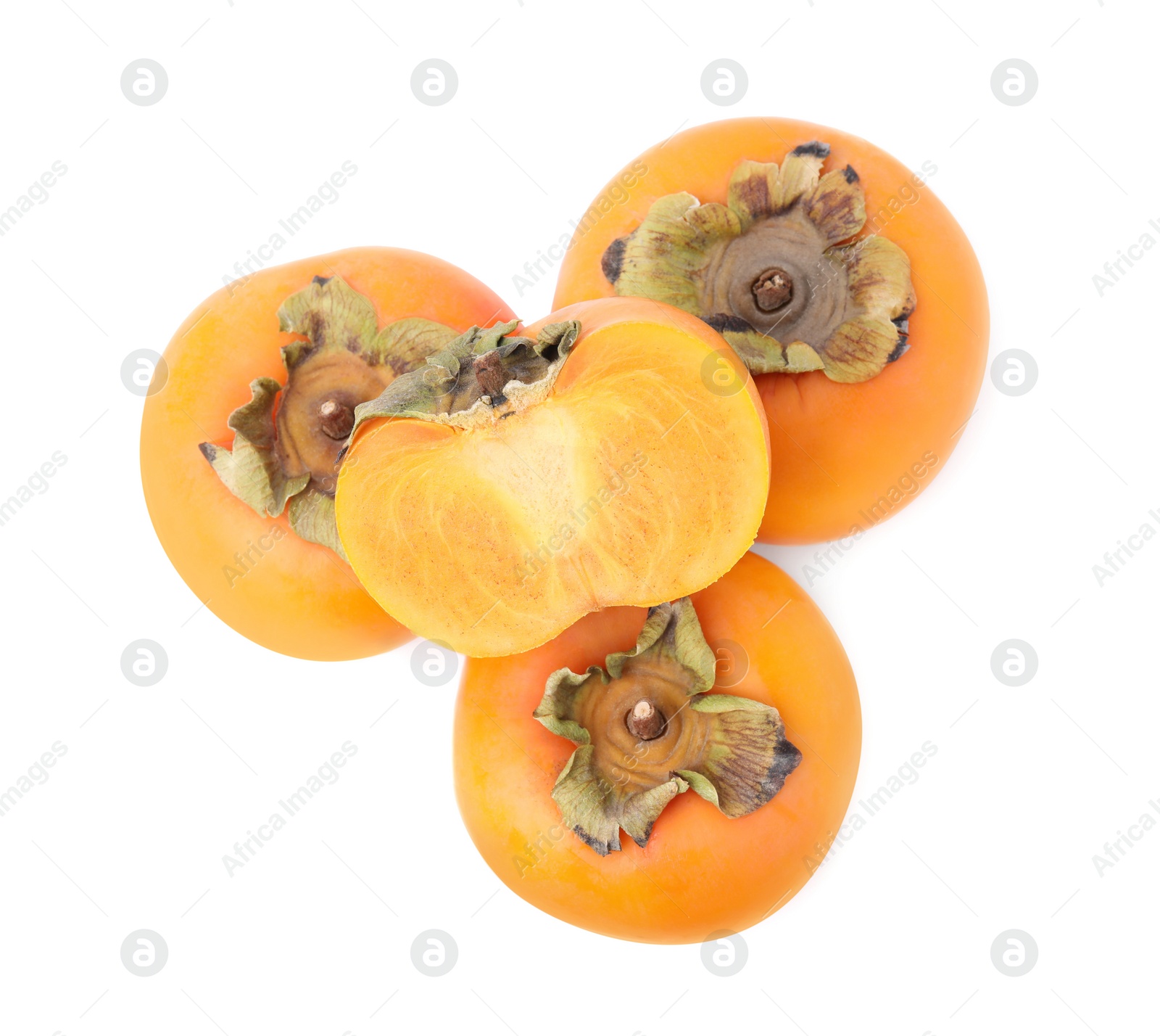 Photo of Whole and cut delicious ripe juicy persimmons on white background, top view