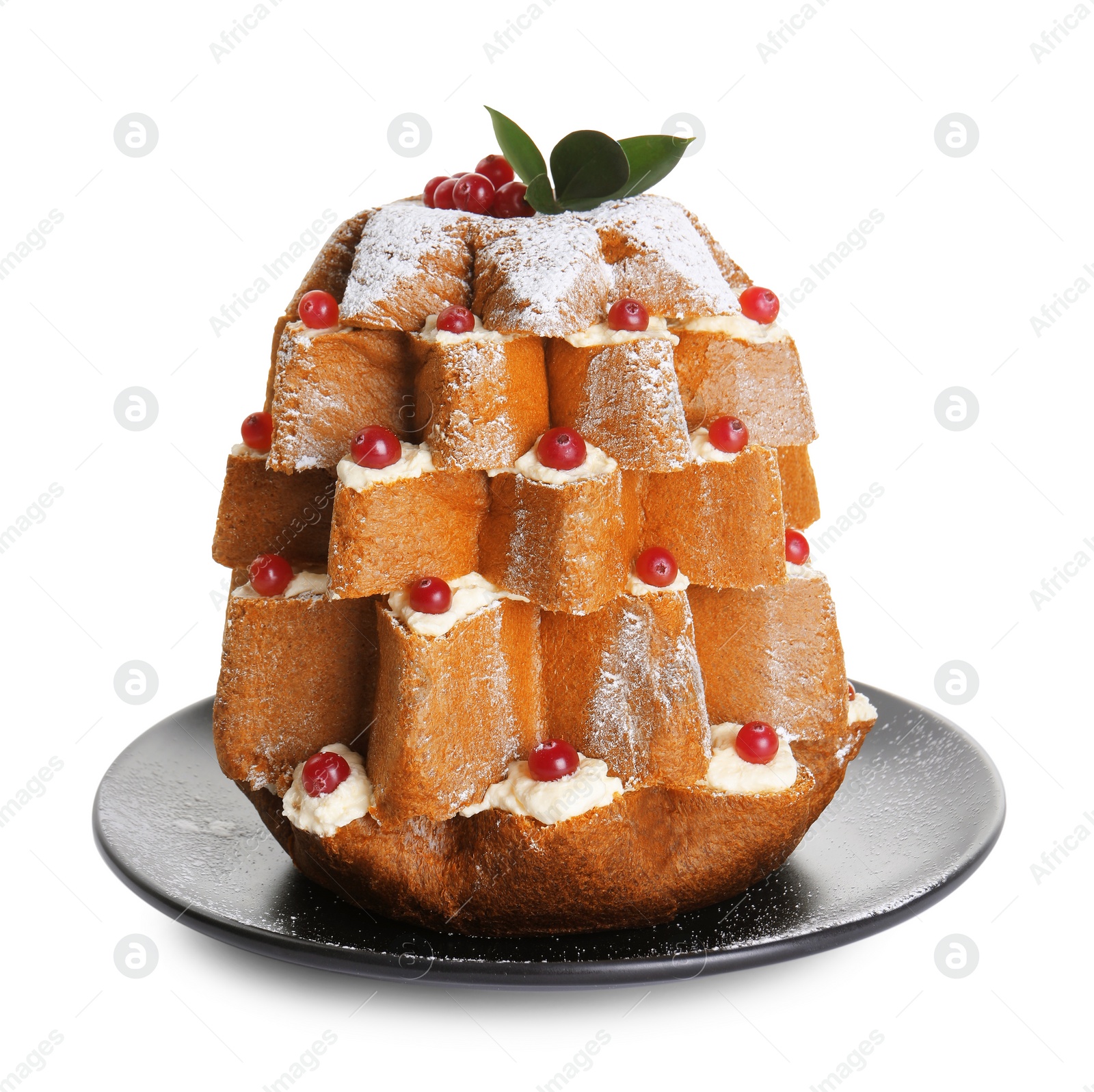 Photo of Delicious Pandoro Christmas tree cake decorated with powdered sugar and berries on white background