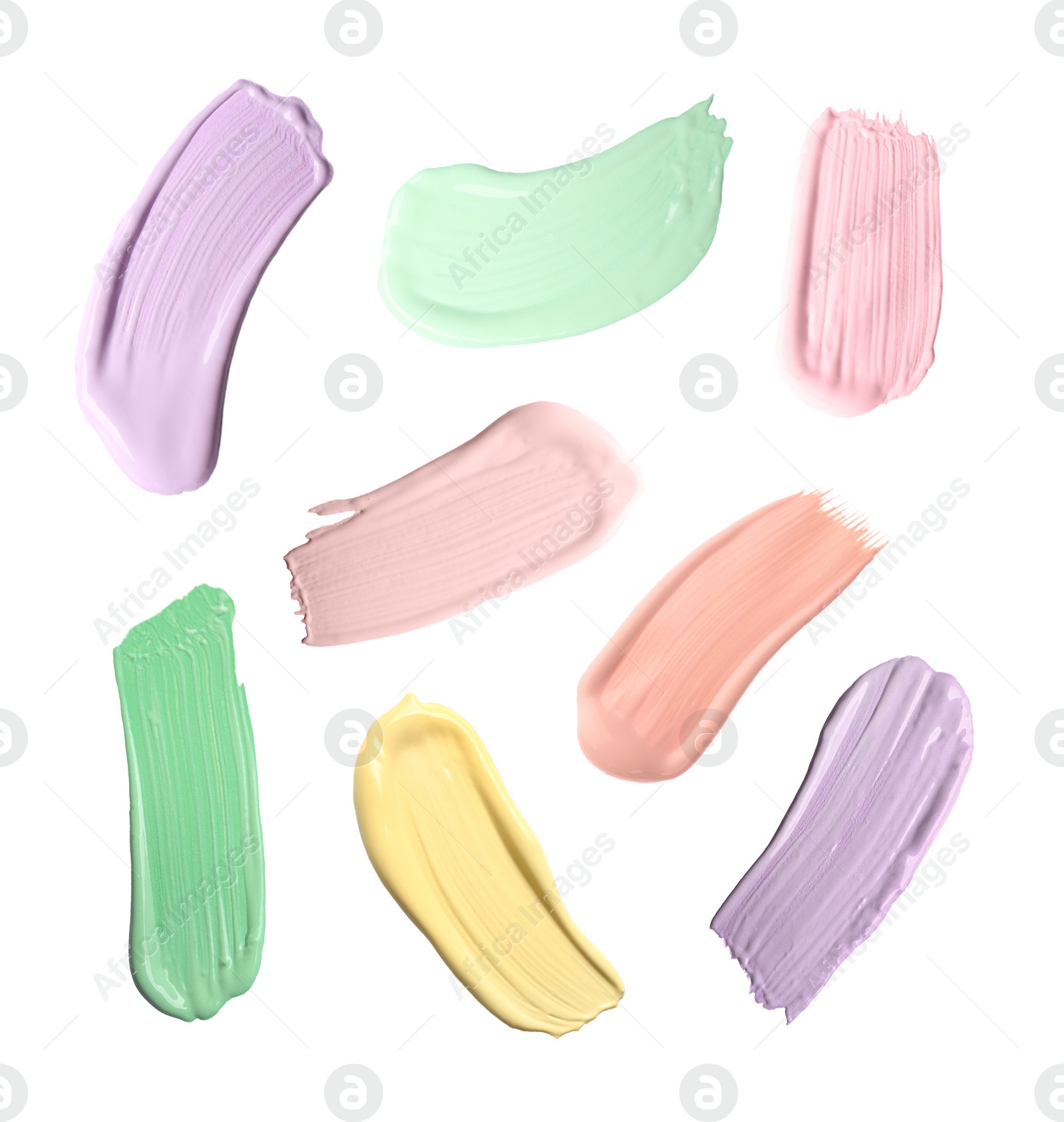 Image of Set with strokes of color correcting concealers on white background, top view