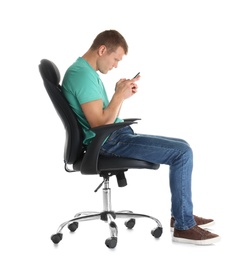 Man with mobile phone sitting in office chair on white background. Posture concept