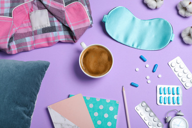 Photo of Flat lay composition with sleeping mask on violet background. Bedtime accessories