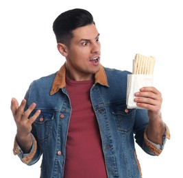 Emotional man with delicious shawarma on white background