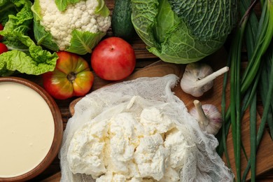Photo of Different fresh ripe vegetables, sour cream and cottage cheese on table, flat lay. Farmer produce