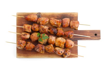 Photo of Board with delicious shish kebabs isolated on white, top view