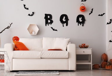 Stylish room interior with creative Halloween decor