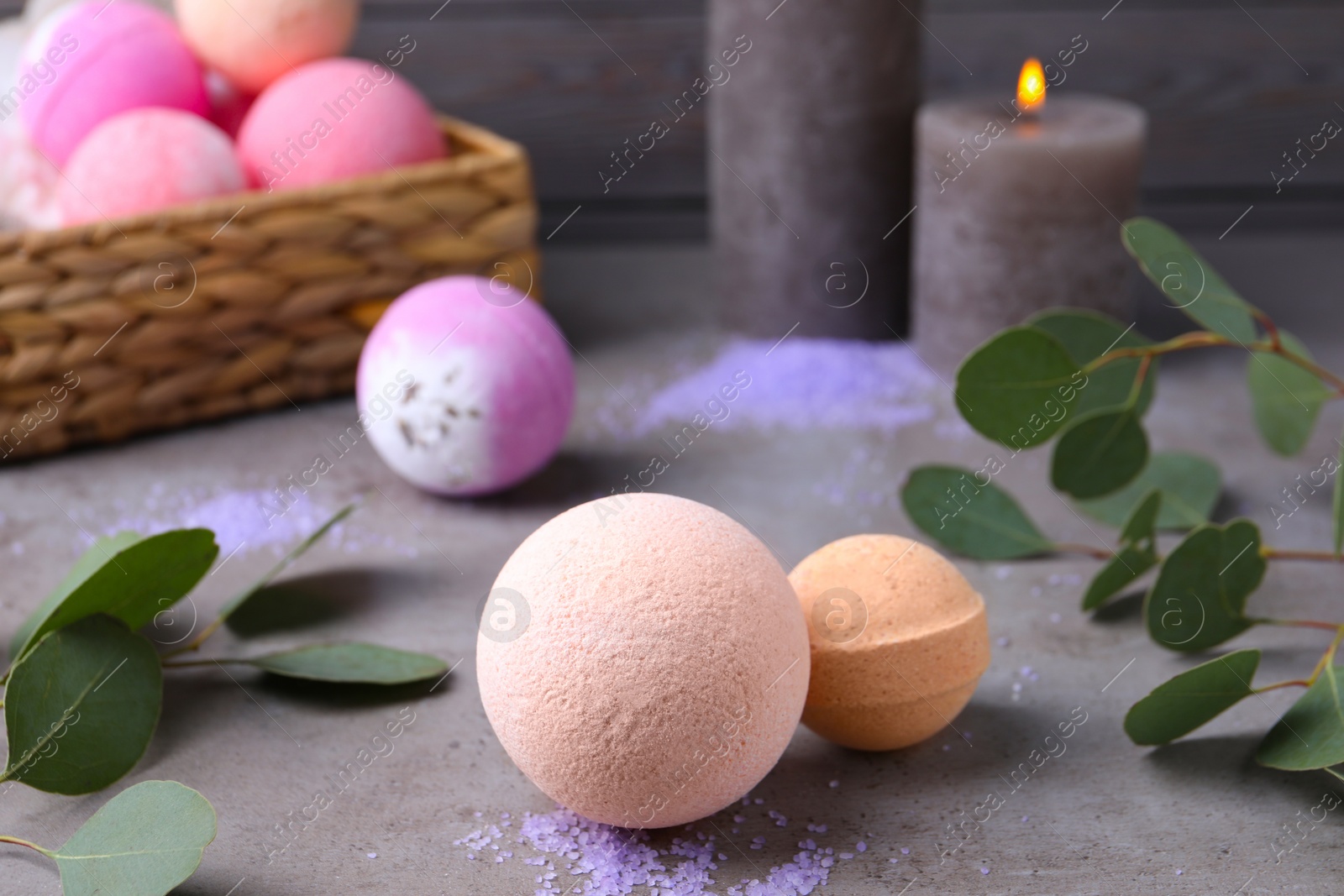 Photo of Beautiful composition with aromatic bath bombs on grey table