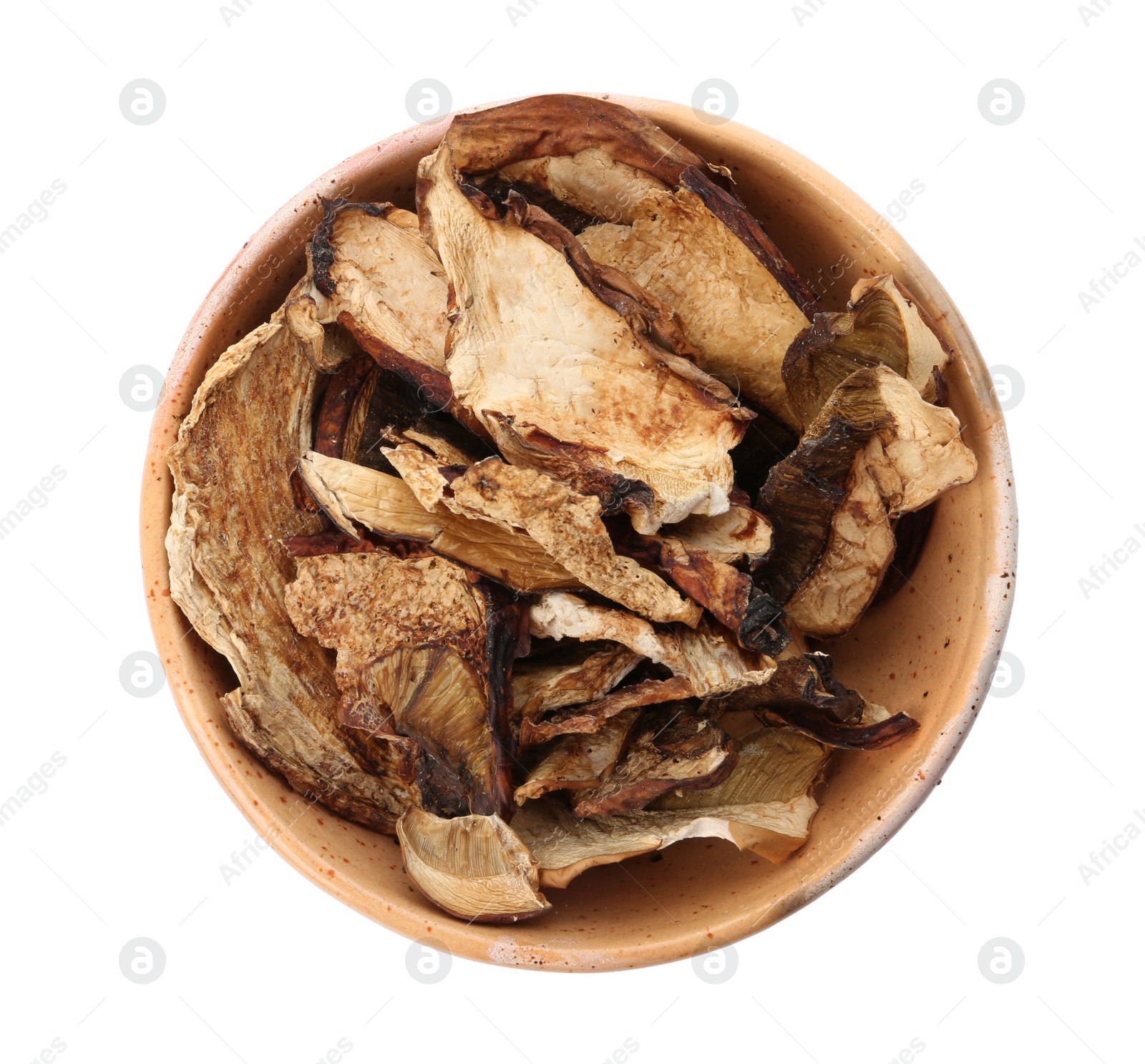 Photo of Bowl of dried mushrooms isolated on white, top view