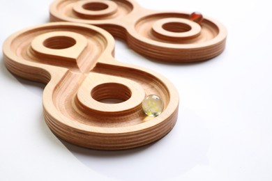 Labyrinth balance boards on white background, closeup. Montessori toy
