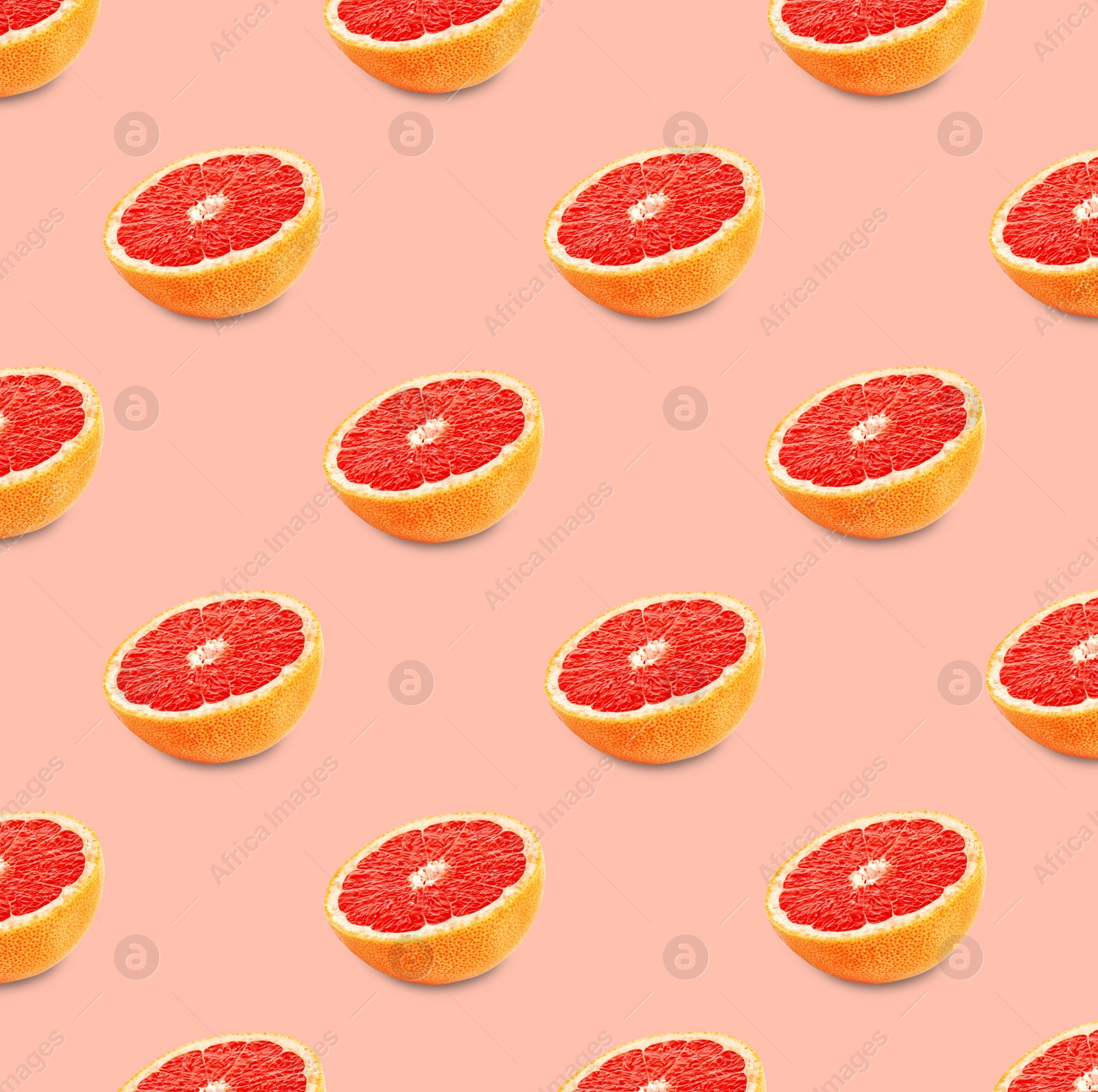 Image of Many fresh ripe grapefruits on pink background. Seamless pattern design