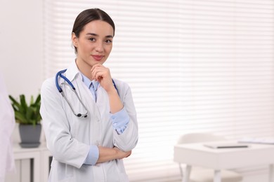 Photo of Medical consultant with stethoscope in clinic, space for text