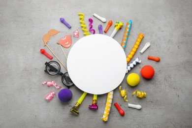 Photo of Flat lay composition with carnival items and blank card on grey background. Space for text