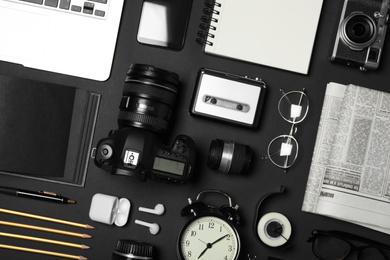 Flat lay composition with equipment for journalist on black background