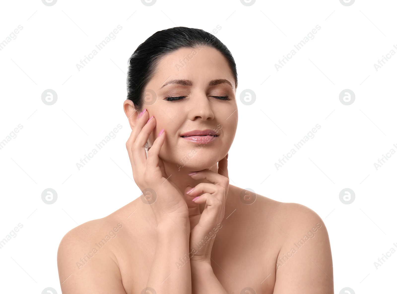 Photo of Beautiful woman with clean skin touching her face on white background