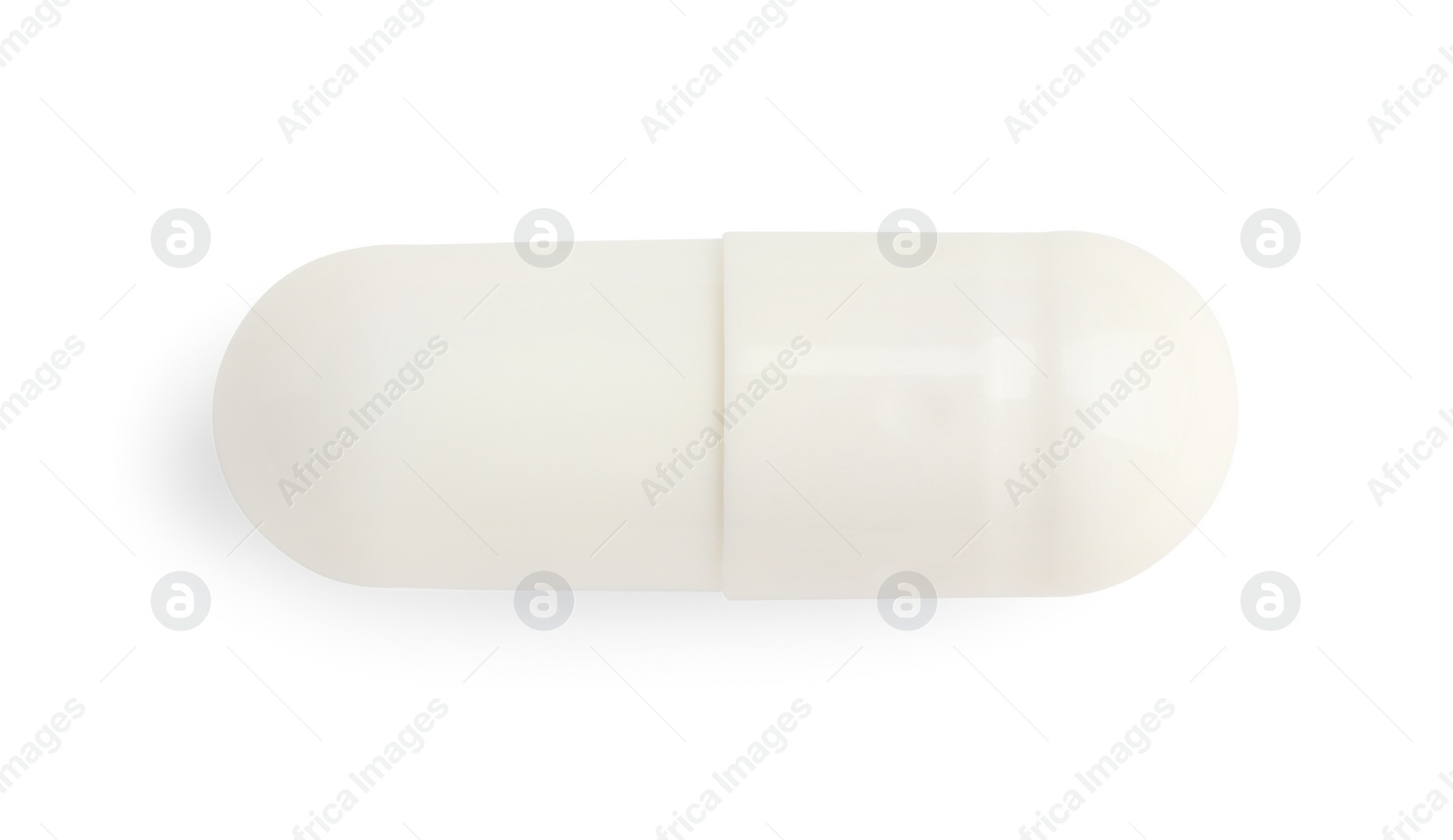 Photo of One pill isolated on white, top view