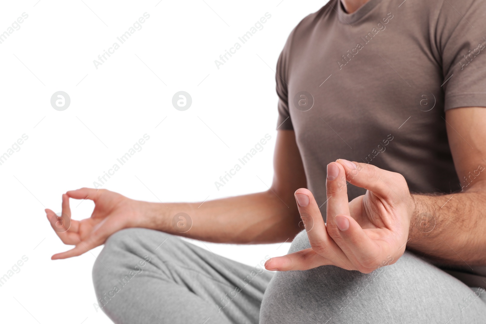 Photo of Man meditating on white background, closeup. Harmony and zen