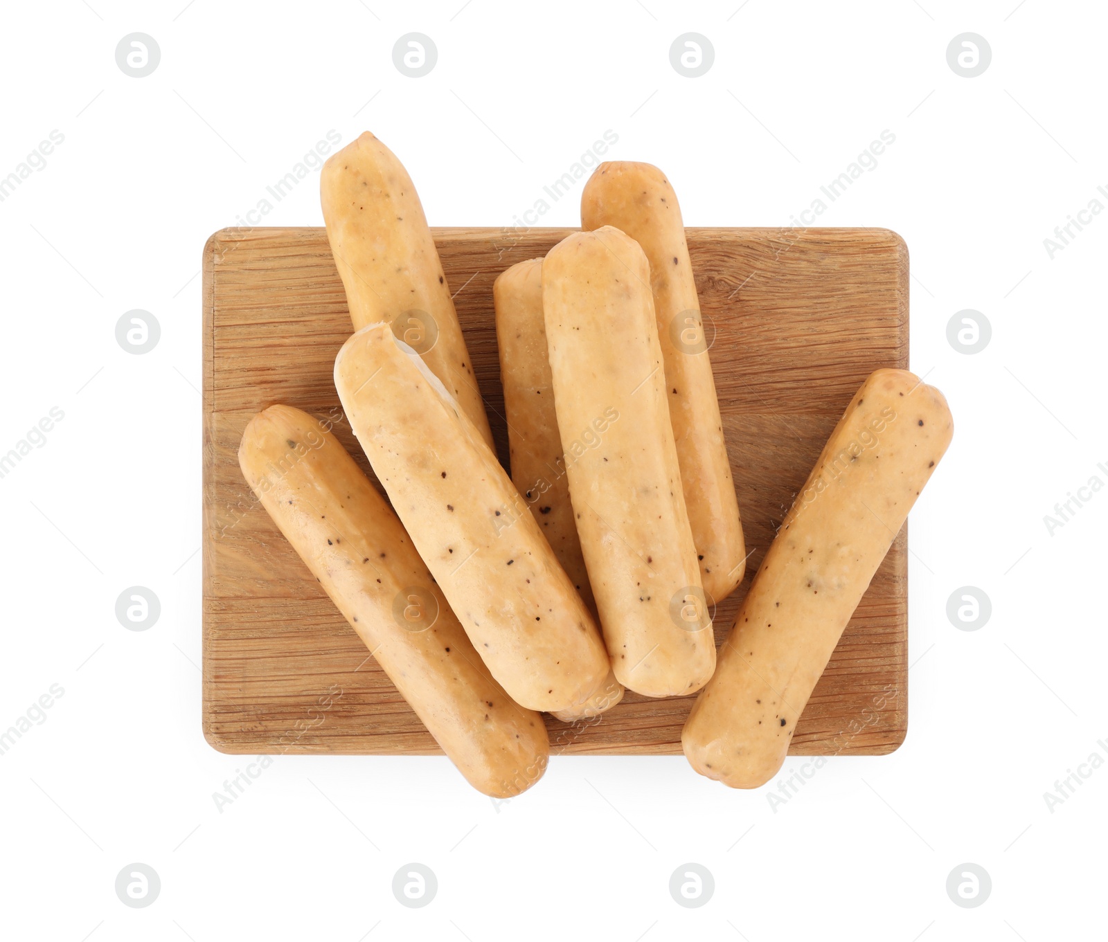 Photo of Many raw sausages with wooden board isolated on white, top view. Vegan meat product