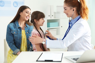 Mother with child visiting doctor in hospital