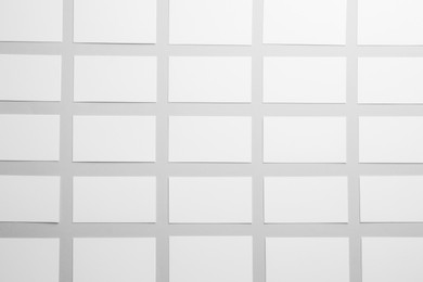 Photo of Blank business cards on light gray background, flat lay. Mockup for design