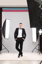 Photo of Handsome model posing in studio. Professional photo session