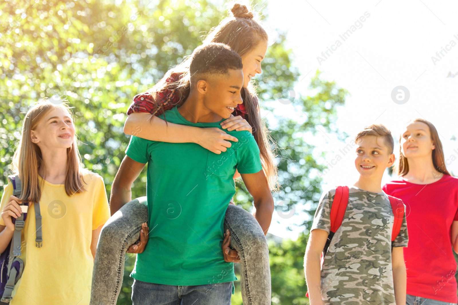 Photo of Group of children outdoors on sunny day. Summer camp